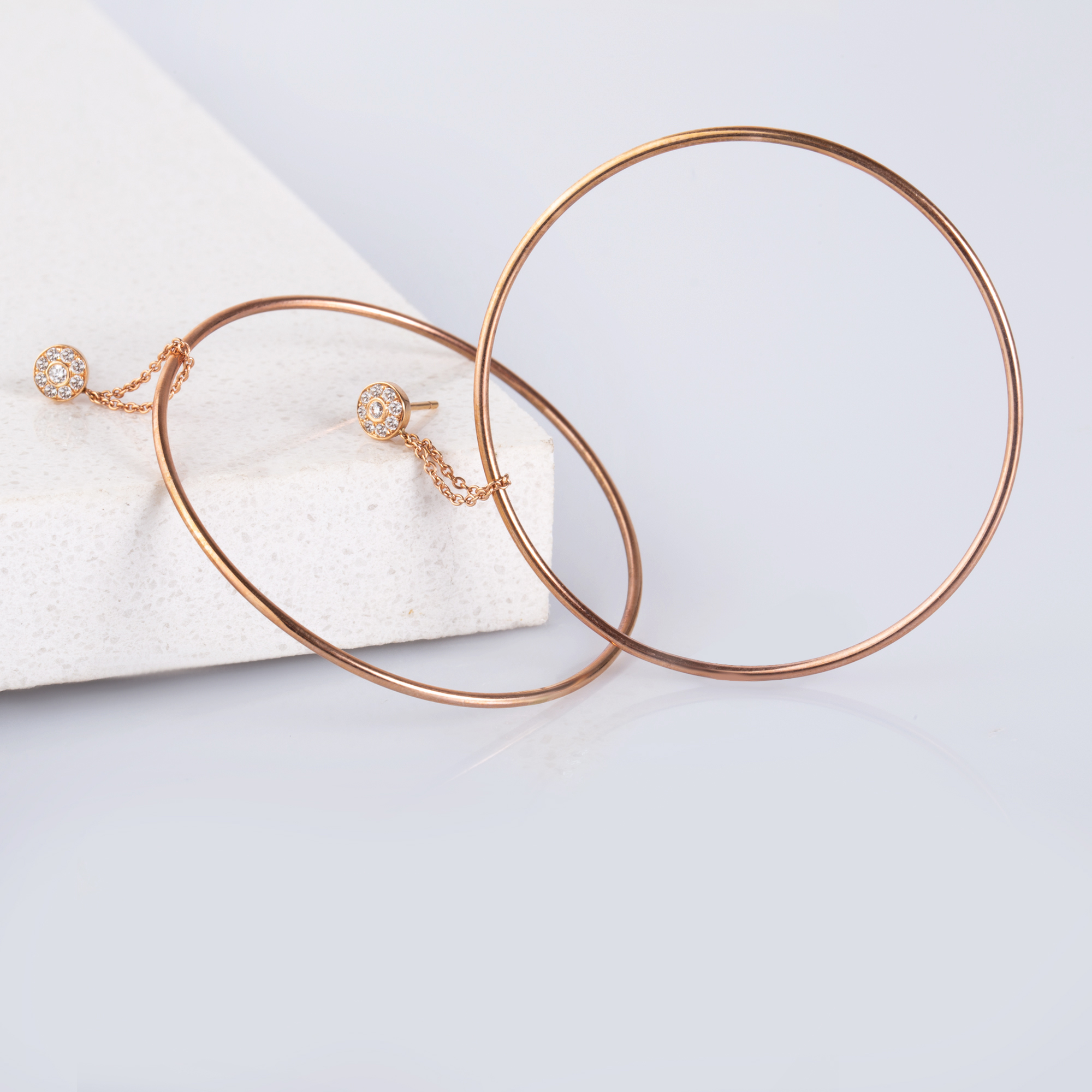 Diamond studs with statement hoops hanging — Melina Fachidis (2)