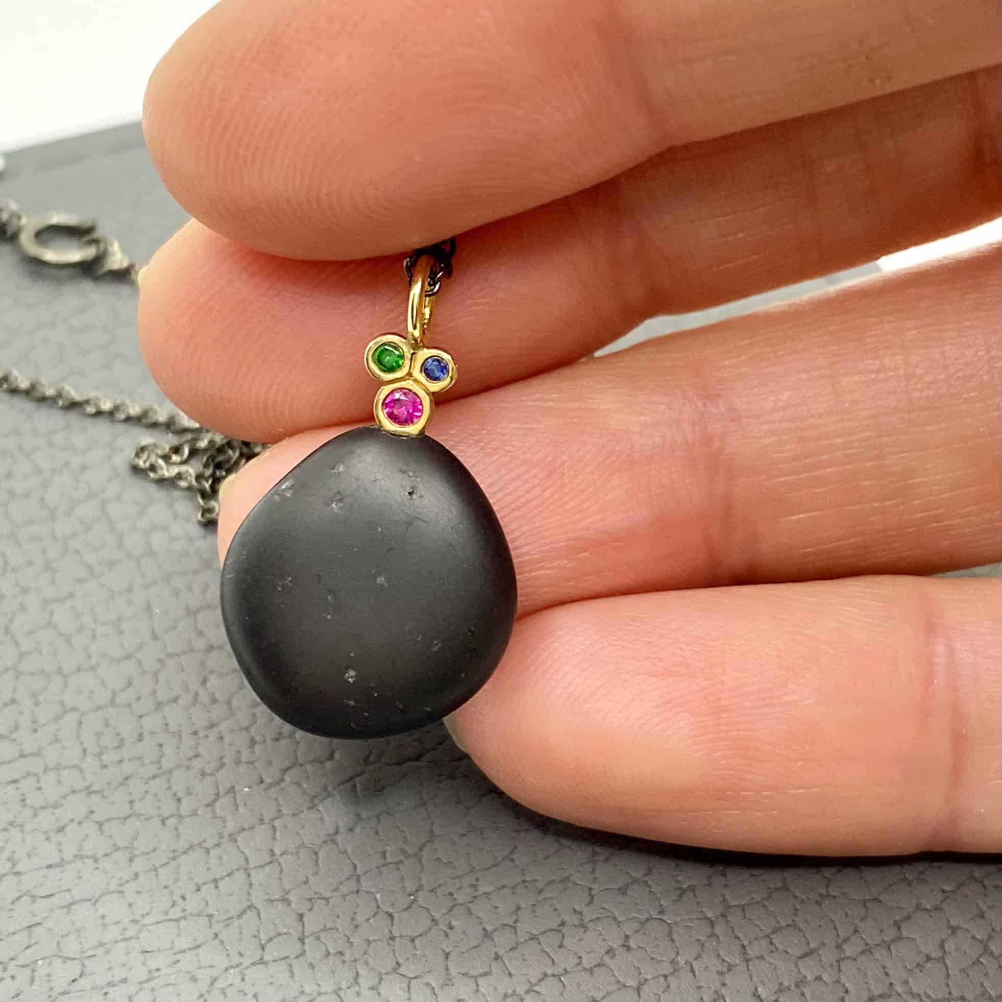 Black sea pebble necklace with ruby, sapphire tzavorite — Melina Fachidis (2)